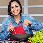 A woman cooking a healthy meal