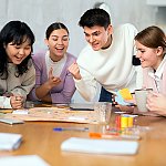 A group of young adults playing a board game