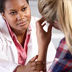 Teen girl meeting with a doctor.