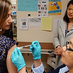 Image of a volunteer receiving a shot