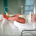 An infants foot in the hospital.