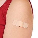 Image of an arm with a bandaid on it.
