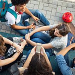 Image of friends laughing and talking