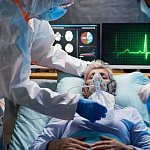 Infected patient in quarantine lying in bed in hospital
