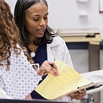 Doctor discussing care with a patient in the emergency room