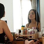Image of a teenage girl looking at a mirror