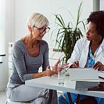 Image of a woman talking to her doctor