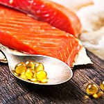 Image of fish oil pills and a salmon filet