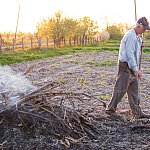 Image of a man burning branches