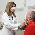 Image of a doctor examining a patient