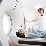 Young woman having CT scan in hospital