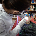 Image of a child receiving a dental exam