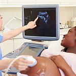 Image of a woman receiving a pregnancy ultrasound