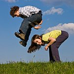 Photo of a boy and a girl playing leap frog