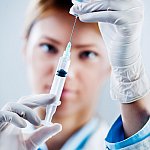 Photo of a woman preparing a flu shot