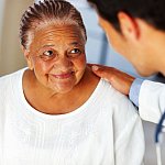 Woman listening to doctor.