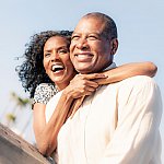 Happy mature couple looking at view.