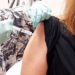 Person receiving a vaccine