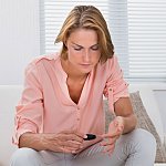 Woman checking blood sugar level