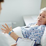 Older woman in hospital bed