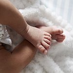 Feet of infant girl.