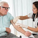 Older man getting blood drawn