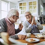 Couple finishing breakfast