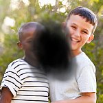 Two children obstructed by black splotch in center.