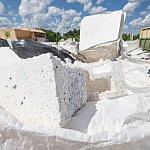 Pile of used polystyrene packing material at waste dump.