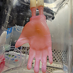 Glove made of bioengineered skin connected to ports for culture infusion in the laboratory