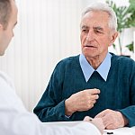 Older man talking to a doctor