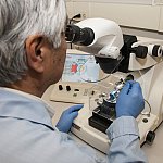 Technician using a microtome.