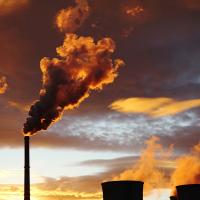 Smoke from coal power plant at sunset