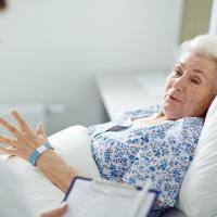Older woman in hospital bed