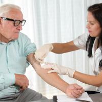Older man getting blood drawn