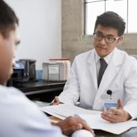 Doctor in consultation with male patient