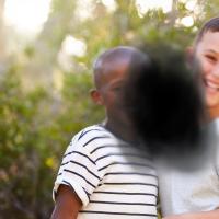 Two children obstructed by black splotch in center.