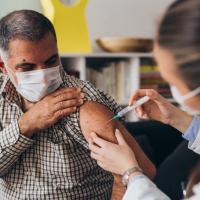 Person getting a booster shot