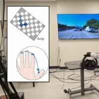 Man with two devices implanted in his brain before a bionic arm controlling a steering wheel and a screen showing traffic. An inset illustration shows movement across a grid reflected on fingers. 