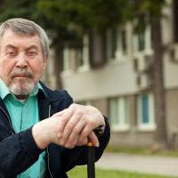 close-up portrait of an old man on a walk in the park