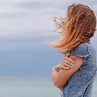 Woman looking out at the sea.