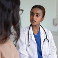 Concerned doctor listens to patient. 