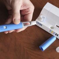 obese fat man preparing Semaglutide Ozempic injection control blood sugar levels 
