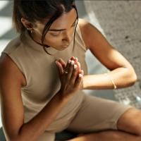 A close-up of a woman practicing yoga.