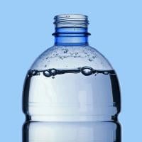A plastic water bottle filled with water.
