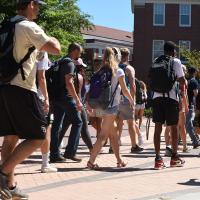 College students walking across campus 