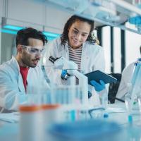 Image of young scientists working in a lab.